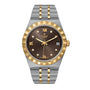 The TUDOR Royal is a sport chic wristwatch with a brown dial, gold Roman numerals, diamond hour markers, date display, automatic movement, and a two-tone stainless steel and gold bracelet.