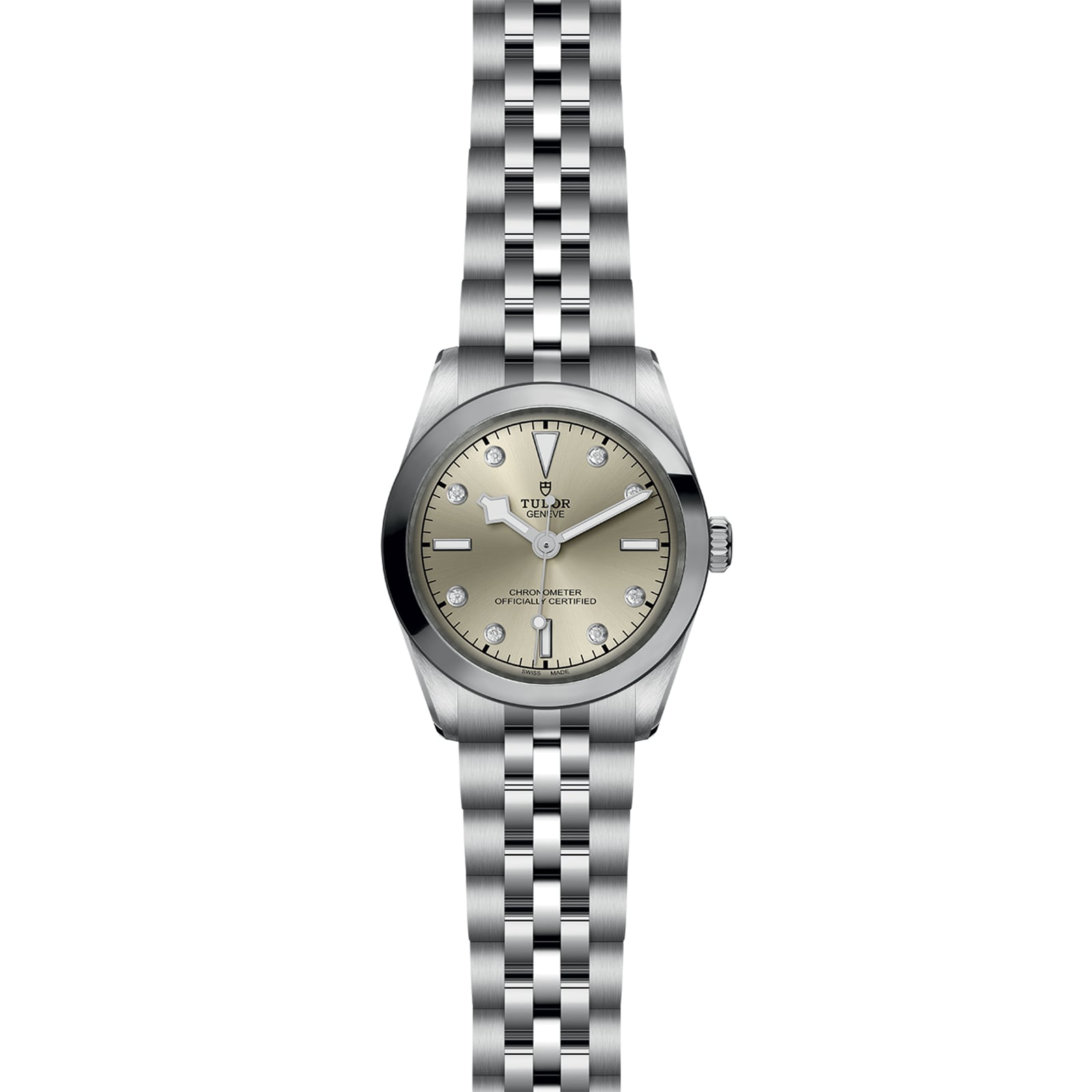 The TUDOR Black Bay One 31 wristwatch features a metal link band, light champagne dial, silver hour markers, and a date window at 3 o’clock; this unisex watch showcases refined watchmaking and is pictured from above on a white background.