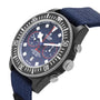 A close-up of a TUDOR Pelagos FXD Chrono watch with a blue strap and black bezel.