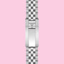 A stainless steel TUDOR bracelet with a polished clasp and embossed shield logo, shown vertically on a light pink background—ideal for pairing with the TUDOR Black Bay Chrono or any Swiss chronometer-certified watch.