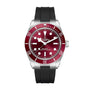 The TUDOR Black Bay 58 is a dive watch featuring a red bezel, black rubber strap, and silver case.