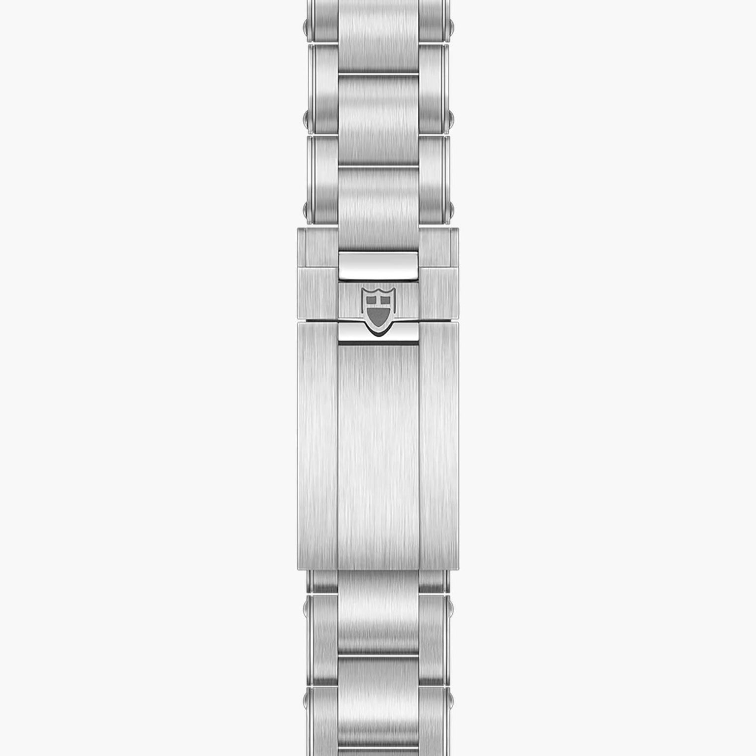 The TUDOR Black Bay 58 features a silver metal watch bracelet with a clasp showcasing an engraved shield logo at the center.