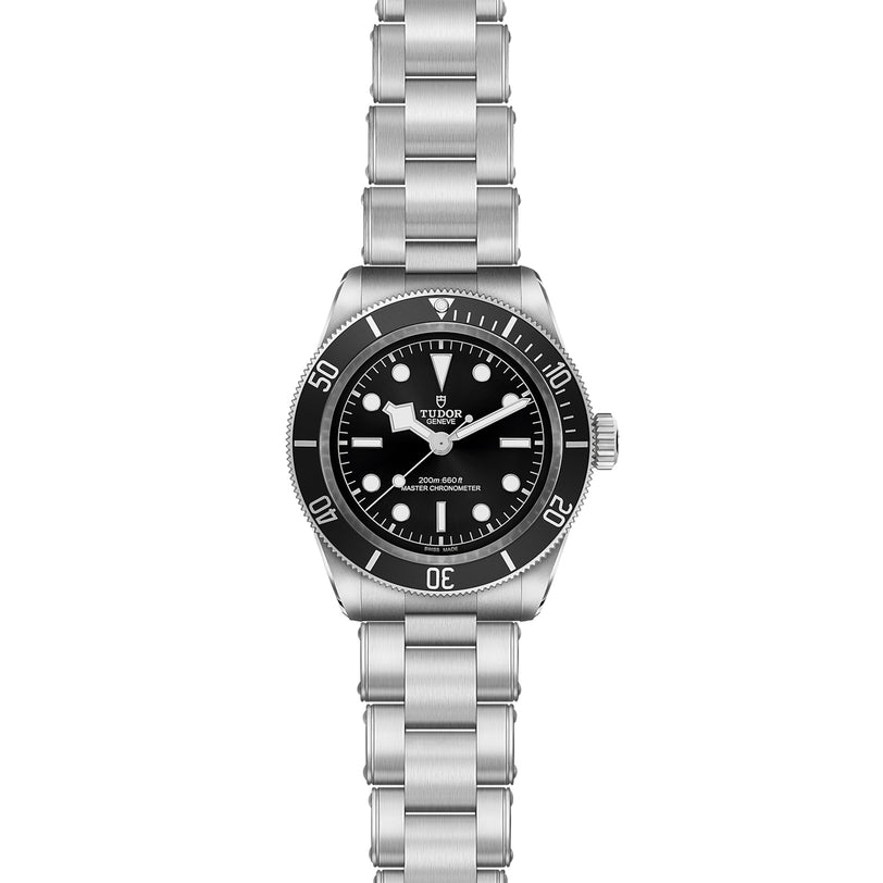 The TUDOR Black Bay wristwatch features a stainless steel case, black dial and bezel, silver hour markers, and a metal bracelet.
