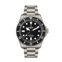 The TUDOR Pelagos Ultra is a stainless steel dive watch featuring a black bezel and dial, white markers, and a date window at 3 o’clock.