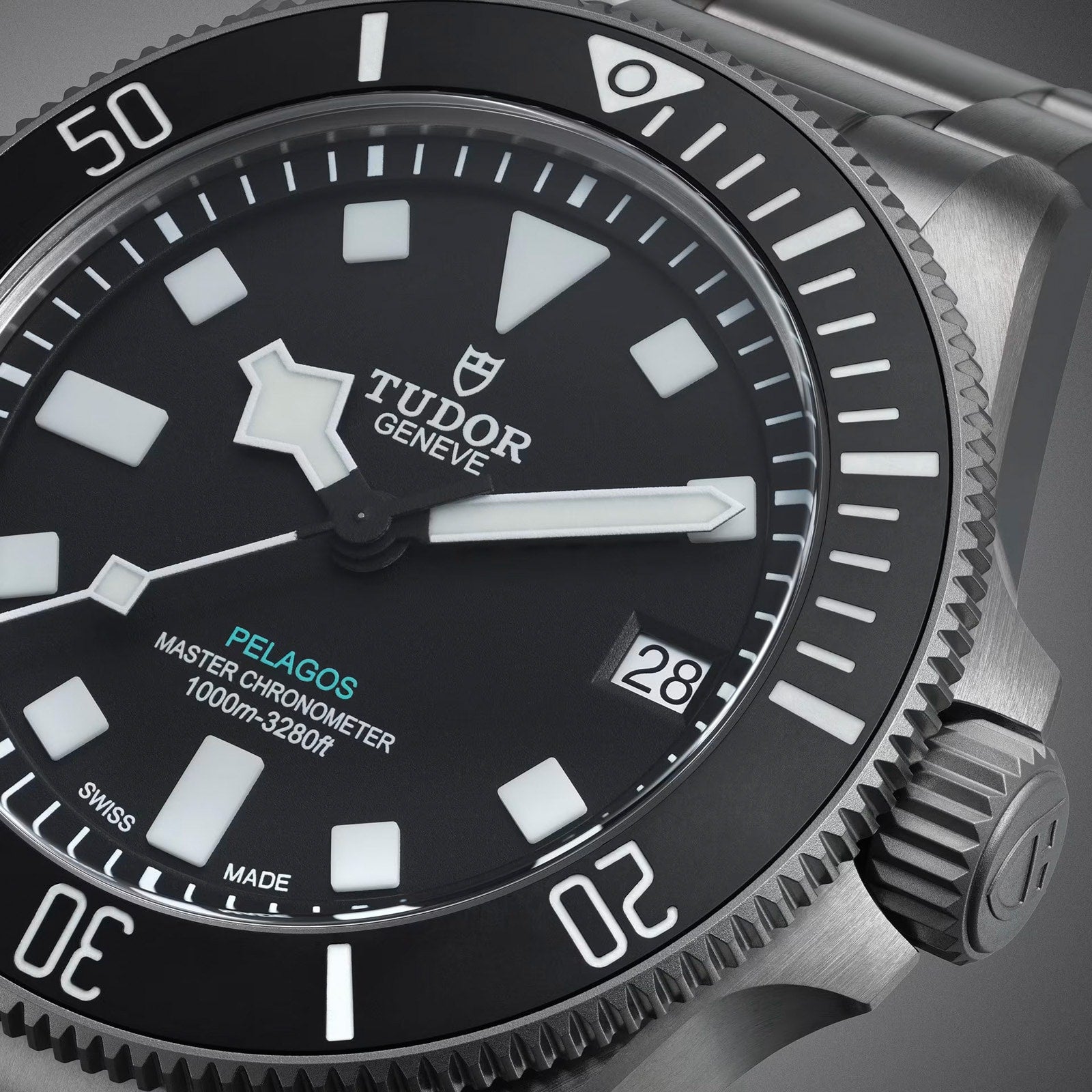 Close-up of a TUDOR Pelagos Ultra dive watch highlighting the dial, bezel, and date window at 3 o’clock.