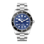 The TUDOR Black Bay 68 is a silver dive watch featuring a blue dial, white hour markers, and a stainless steel bracelet.