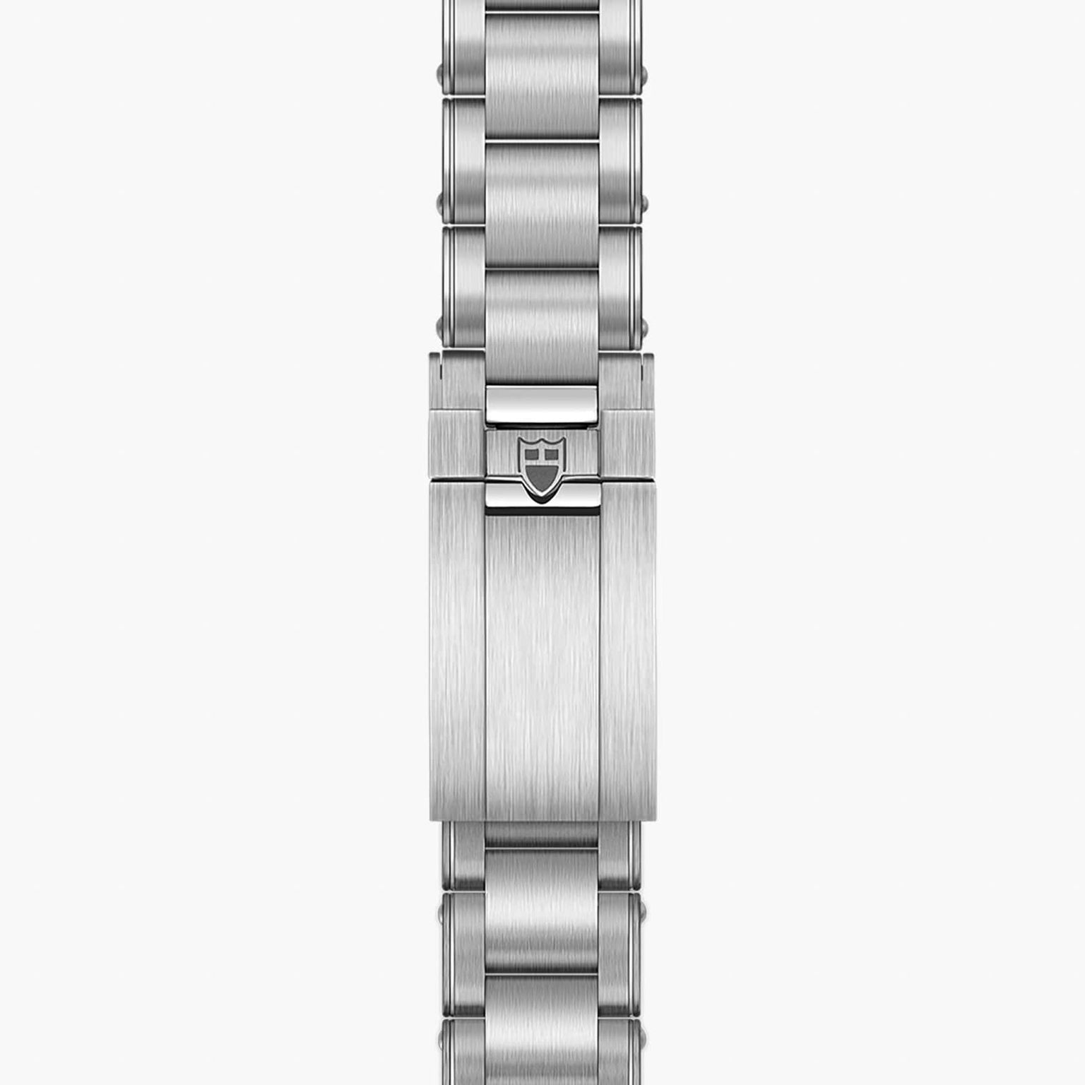 Close-up of the TUDOR Black Bay Pros stainless steel bracelet featuring the brands shield logo on the clasp.