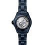 Back view of the Chanel J12 Bleu Watch Caliber 12.1, 38 mm in blue metal, revealing its exposed mechanical movement and Limited Edition engraving.