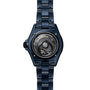 Back view of the Chanel J12 Bleu Watch Caliber 12.1, 38 mm, displaying its mechanical movement and Limited Edition engraving.