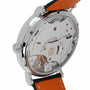 Close-up of the back of the IWC Schaffhausen Portofino Hand-Wound Eight Days, highlighting its 59210 caliber movement, engraved markings, and striking orange leather strap.