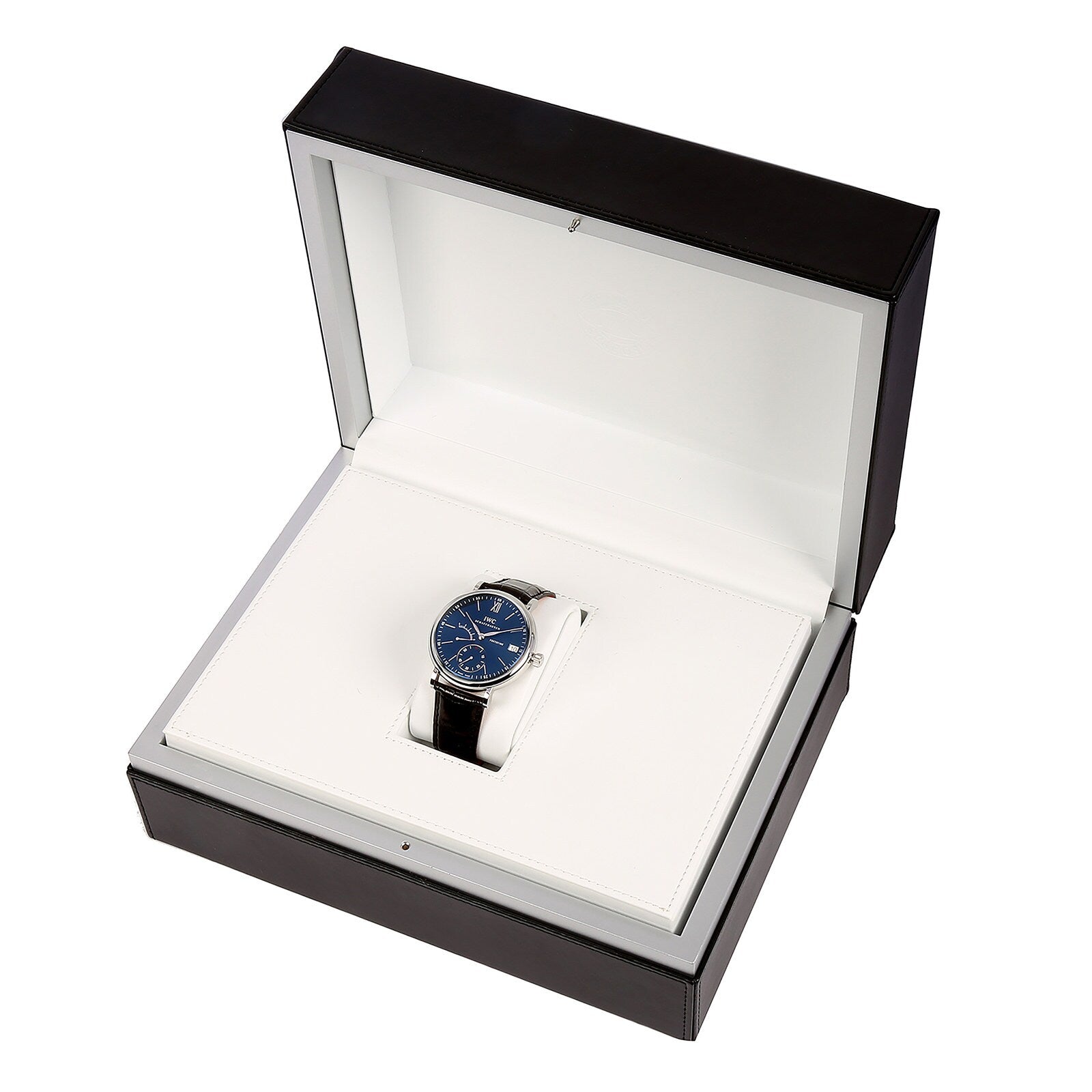 An IWC Schaffhausen Portofino Hand-Wound Eight Days watch, featuring a blue dial and black strap, is displayed inside an open white and black presentation box.