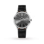 The IWC Schaffhausen Portofino Chronograph is an elegant ladies’ watch with a round black dial, silver hands, Roman numerals at 12 and 6, a date display at 3 o’clock, and a classic black leather strap.
