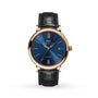 The IWC Schaffhausen Portofino Automatic features a blue dial, gold case, black leather strap, date at 3 o’clock, Roman numeral XII on the face, and Swiss automatic self-winding movement.