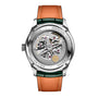 Back view of the IWC Schaffhausen Portugieser Perpetual Calendar 42, featuring its exposed mechanical movement, intricate engravings, and a brown leather strap with green-edged accents.