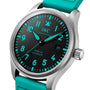 A close-up of the IWC Schaffhausen Pilots Watch Mark XX Mercedes-AMG PETRONAS, featuring a black dial with turquoise numerals, hands, and strap.