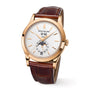 Patek Philippe Complication 5396R-011: gold watch with brown leather strap, white dial, and moon phase display.