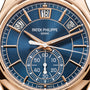 Close-up of the Patek Philippe Complications 5905R-010 watch, featuring a blue dial with displays for day, date, month, and seconds.