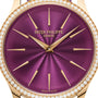 Close-up of the Patek Philippe Calatrava 4997/200R-001 watch featuring a purple dial, gold markers, and a diamond-set bezel.