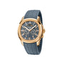 Patek Philippe Aquanaut 5261R-001 gold wristwatch featuring a blue dial with multiple subdials and a textured blue rubber strap.