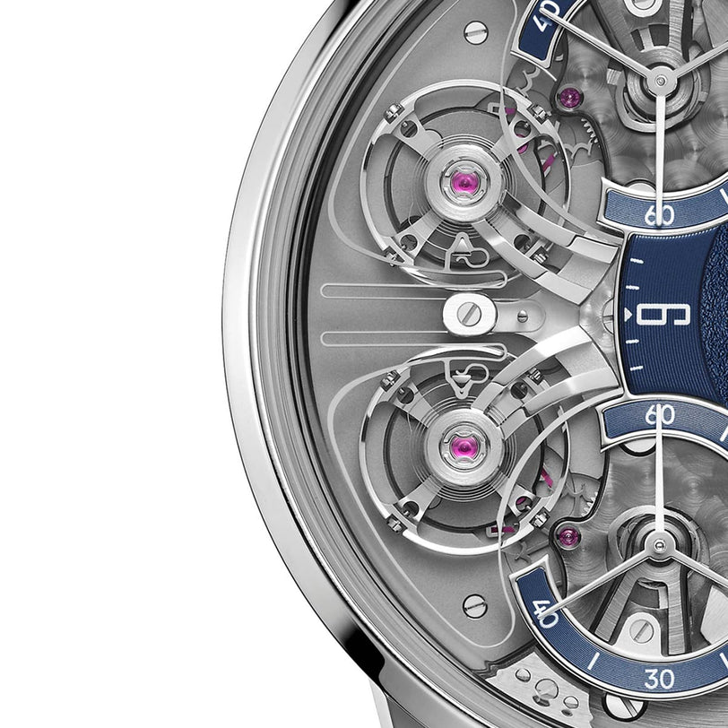 Close-up of the Armin Strom Mirrored Force Resonance Manufacture Edition Blue watch face, featuring exposed gears, metal details, and blue accents with numbers.