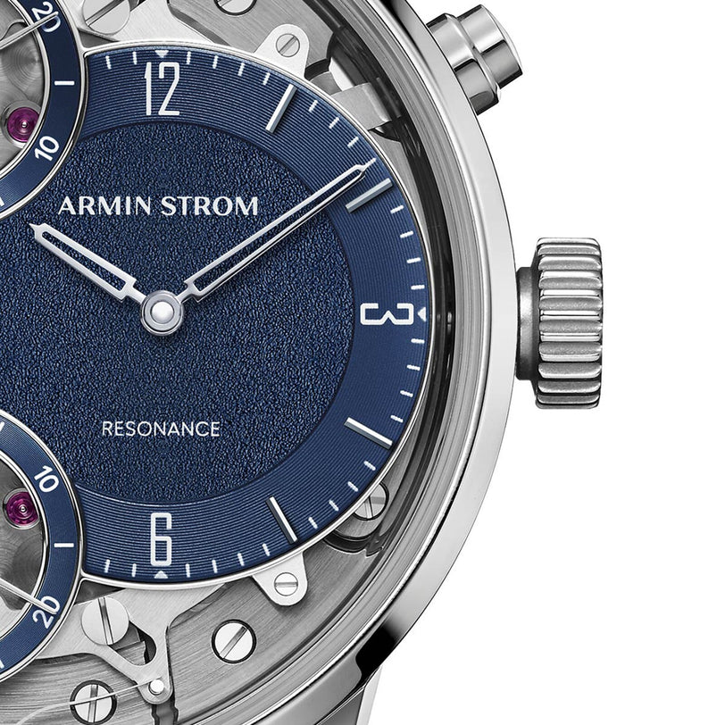 Close-up of the Armin Strom Mirrored Force Resonance Manufacture Edition Blue wristwatch, featuring a blue textured dial with silver accents and part of the case.
