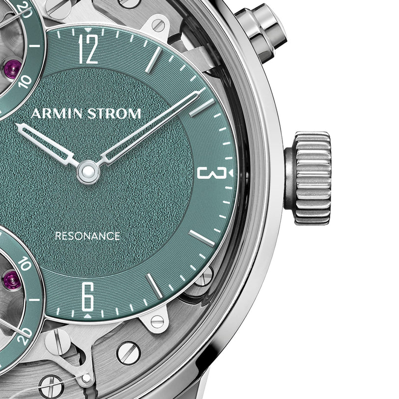Close-up of the Armin Strom Mirrored Force Resonance Manufacture Edition Green wristwatch, featuring a green textured dial and visible mechanical details.