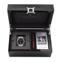 The Reservoir GT Tour luxury watch gift set includes a watch, extra strap, and instruction booklet, all elegantly presented in a black box.