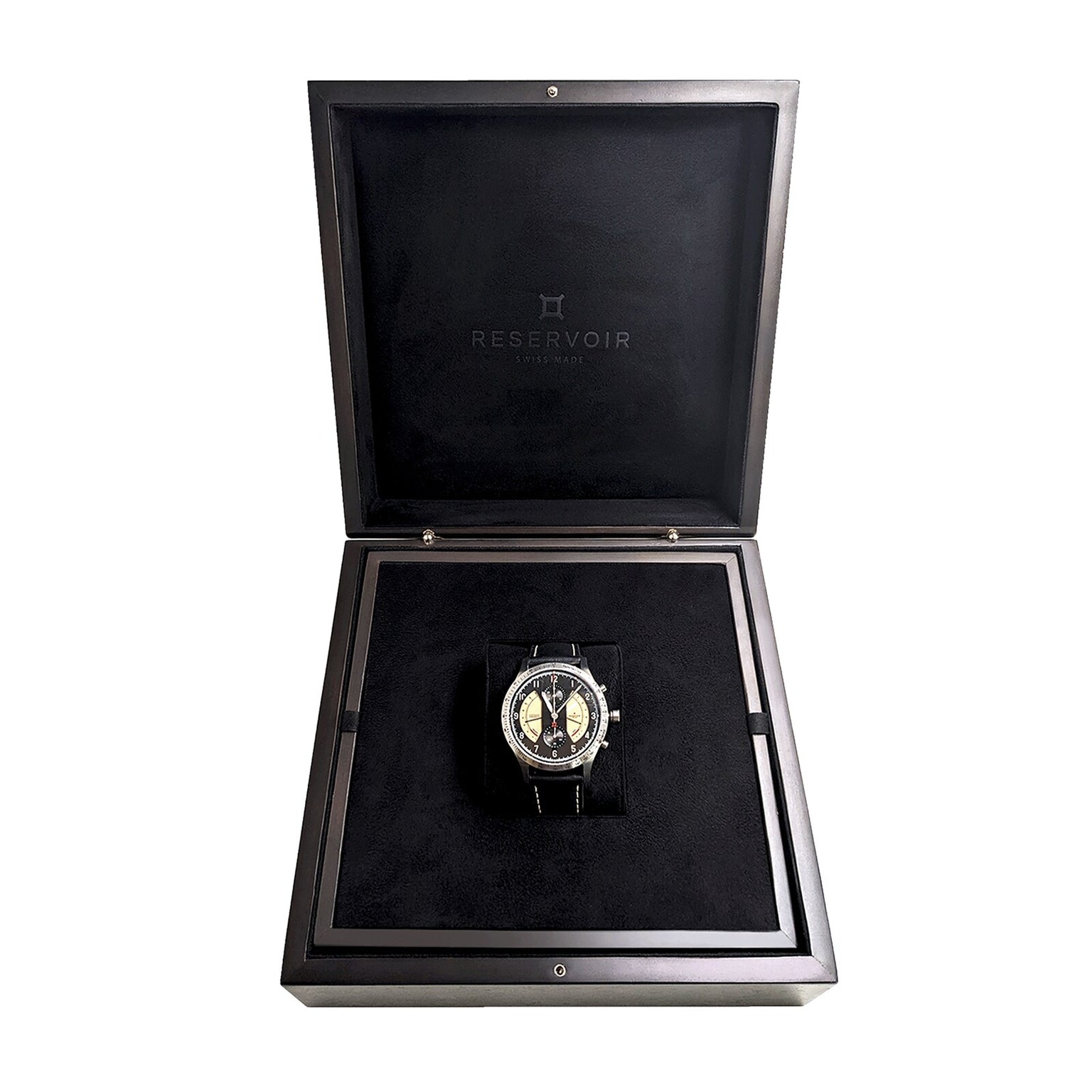 The Sonomaster Chronograph Vintage by Reservoir is showcased in an open black Reservoir box with a soft, velvet interior.
