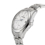 The Grand Seiko Spring Drive Heritage wristwatch features a white dial, silver hour markers, and a stainless steel bracelet, shown at an angle to highlight its precise Spring Drive movement.