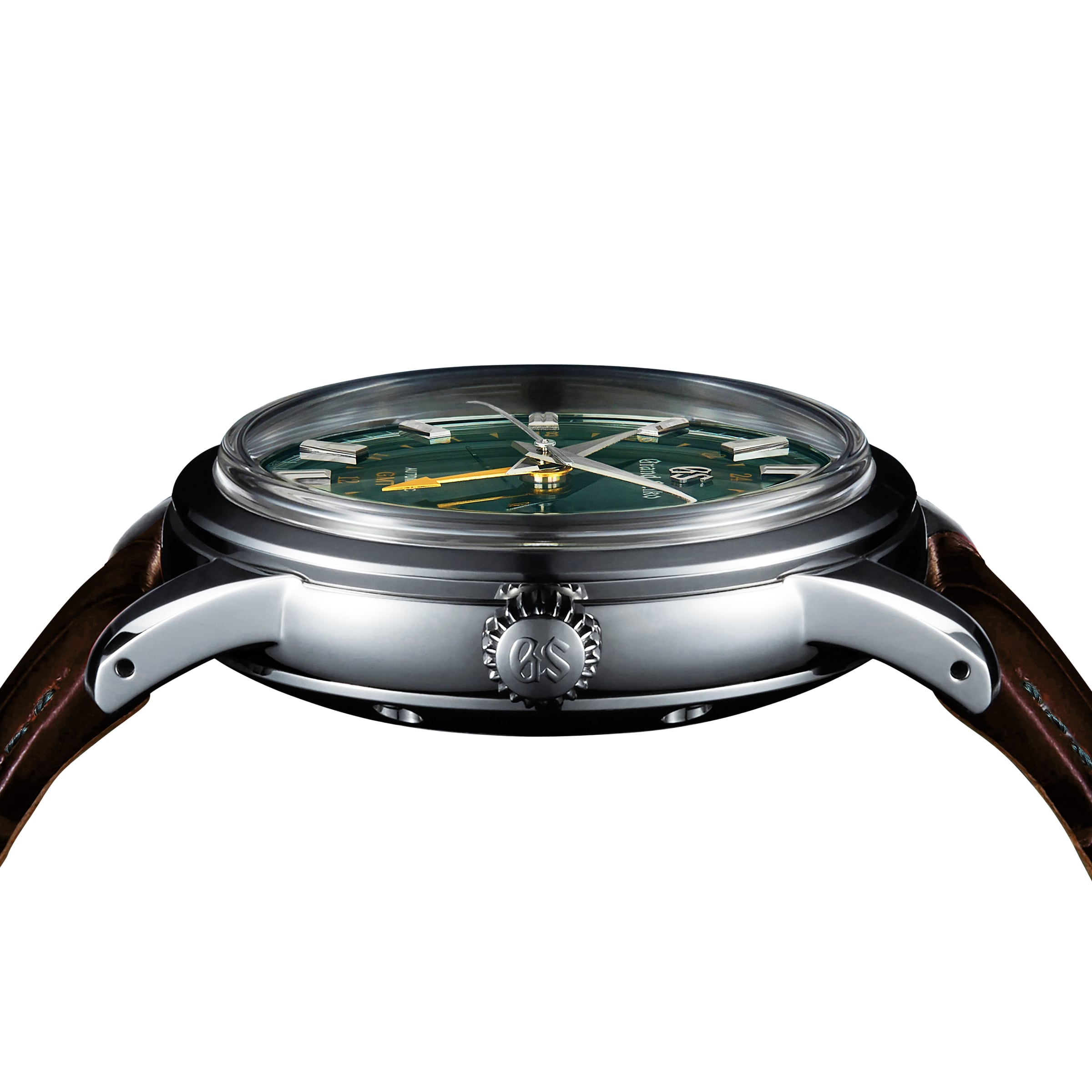 Side view of the Grand Seiko Automatic GMT Elegance wristwatch with a British Racing Green dial, silver case, visible GS-marked crown, and brown leather strap.