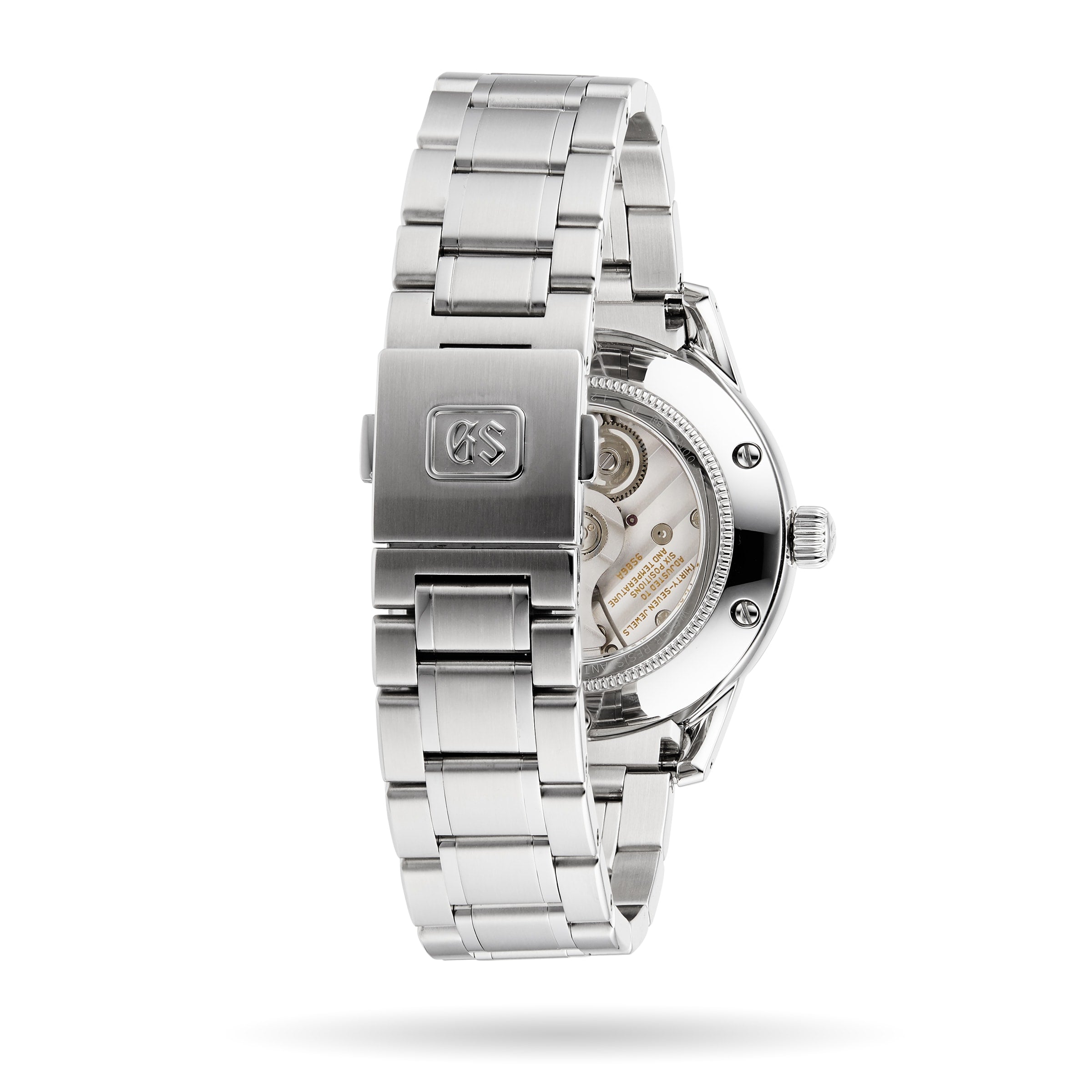 A Grand Seiko Hi-Beat GMT Elegance stainless steel watch with a clasp engraved logo, displaying its Calibre 9S86 movement through a transparent case back.
