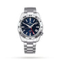 The Grand Seiko Automatic GMT Sport is a stainless steel watch featuring a blue dial, luminescent hands and markers, and a red GMT hand for tracking dual time, shown on a white background.