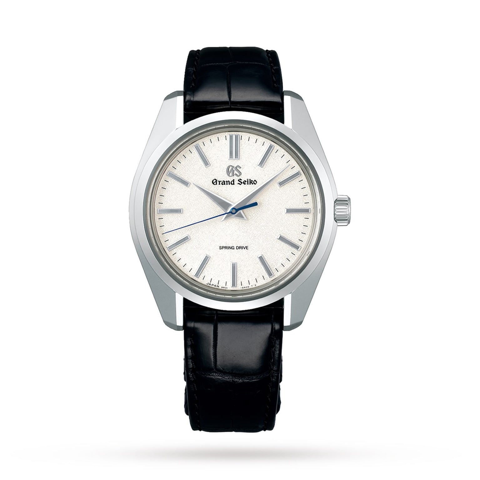 A Grand Seiko Spring Drive Heritage watch featuring a silver textured dial, silver indices, black leather strap, and three central hands.