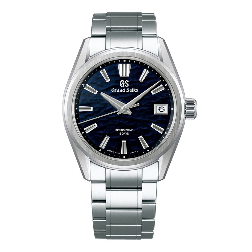 The Grand Seiko Spring Drive 5 Days Evolution 9 is a stainless steel watch featuring a blue textured dial and a date window at 3 o’clock.