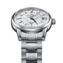 The Grand Seiko Hi-Beat GMT Elegance features a stainless steel case, textured white dial, black hour markers, date window at 3 o’clock, and automatic movement, shown from an angled front view.