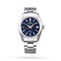 The Grand Seiko Hi-Beat Heritage is a stainless steel wristwatch with a blue dial, silver hour markers, 9S85 mechanical movement, date display at 3 o’clock, and metal bracelet from the Japanese Seasons collection.