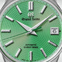 Close-up of the Grand Seiko Hi-Beat Limited Edition Heritage watch, featuring a textured green dial inspired by Jodogahama beach, silver markers and hands, date at 3 o’clock, HI-BEAT 36000 above 6 o’clock, and the 9S85 calibre automatic movement.