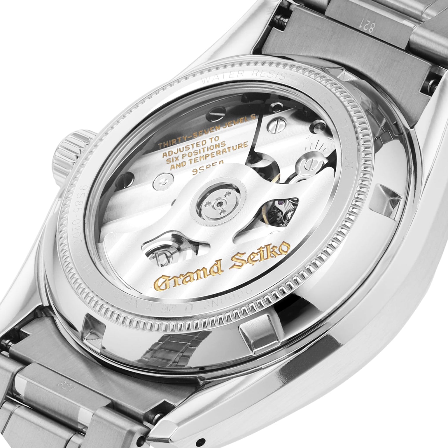 Close-up of the back of a Grand Seiko Hi-Beat Heritage wristwatch showing the exposed hi-beat movement through its transparent case back.