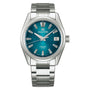 The Grand Seiko Spring Drive 5 Days Evolution 9 features a teal dial, silver markers and hands, a date window at 3 o’clock, metal link bracelet, and is powered by the precise Spring Drive Caliber 9RA2.