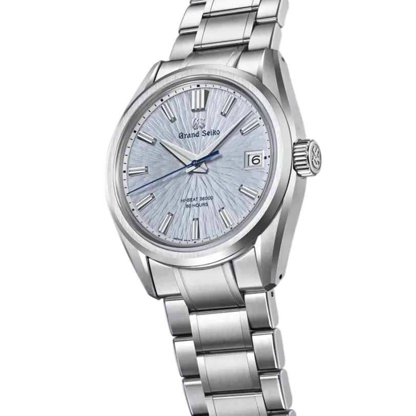 The Grand Seiko Hi-Beat 80 Hours Evolution 9 wristwatch features a textured light blue dial, silver markers, and a stainless steel bracelet.