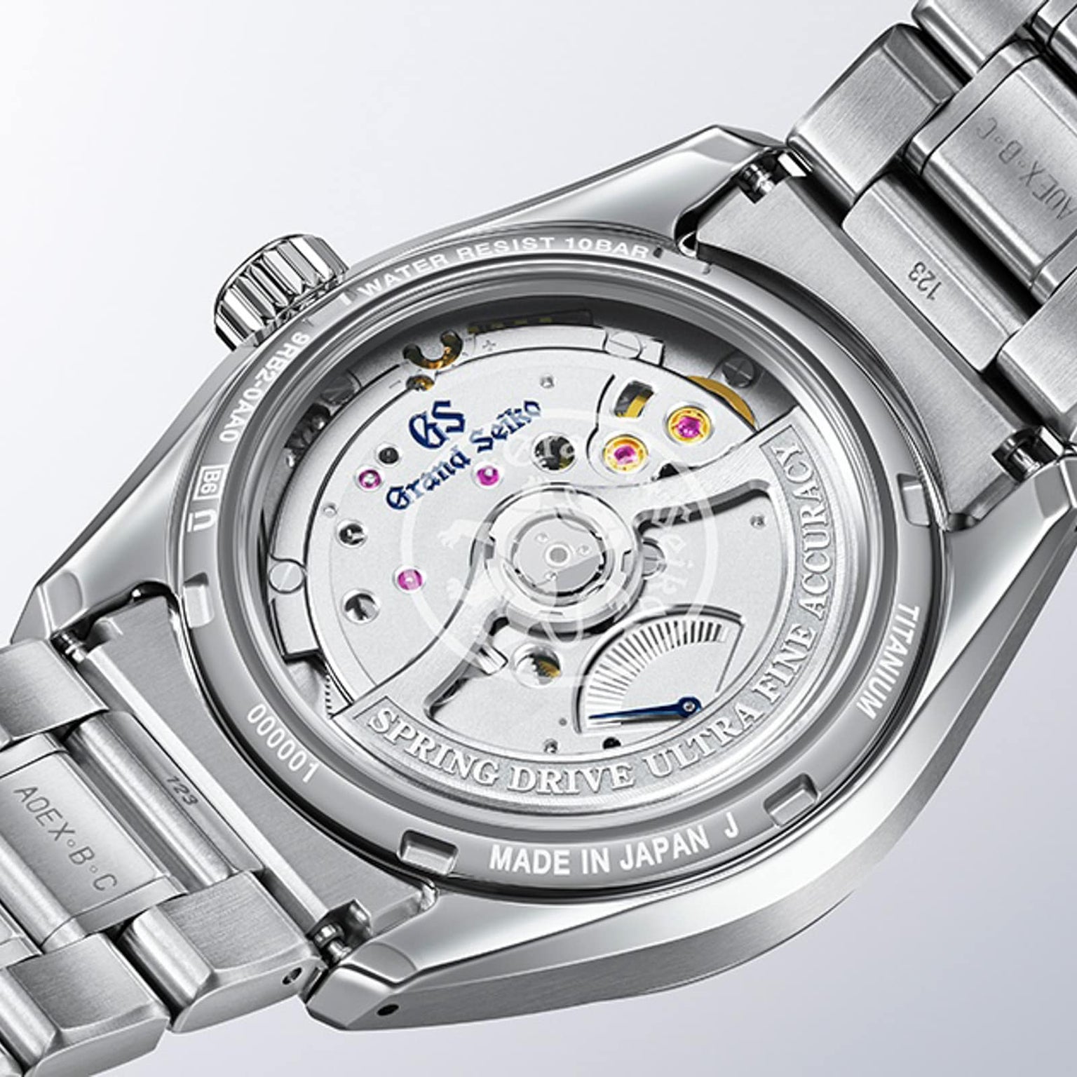 Close-up of Grand Seikos Spring Drive U.F.A Evolution 9 transparent case back, revealing the intricate mechanical movement within.