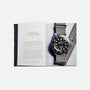 An open copy of Watches: A Guide By HODINKEE by Hodinkee shows a foreword titled Why Watches? on the left page and a striped-strap wristwatch photo on the right, capturing the passion found in every Hodinkee watch guide.