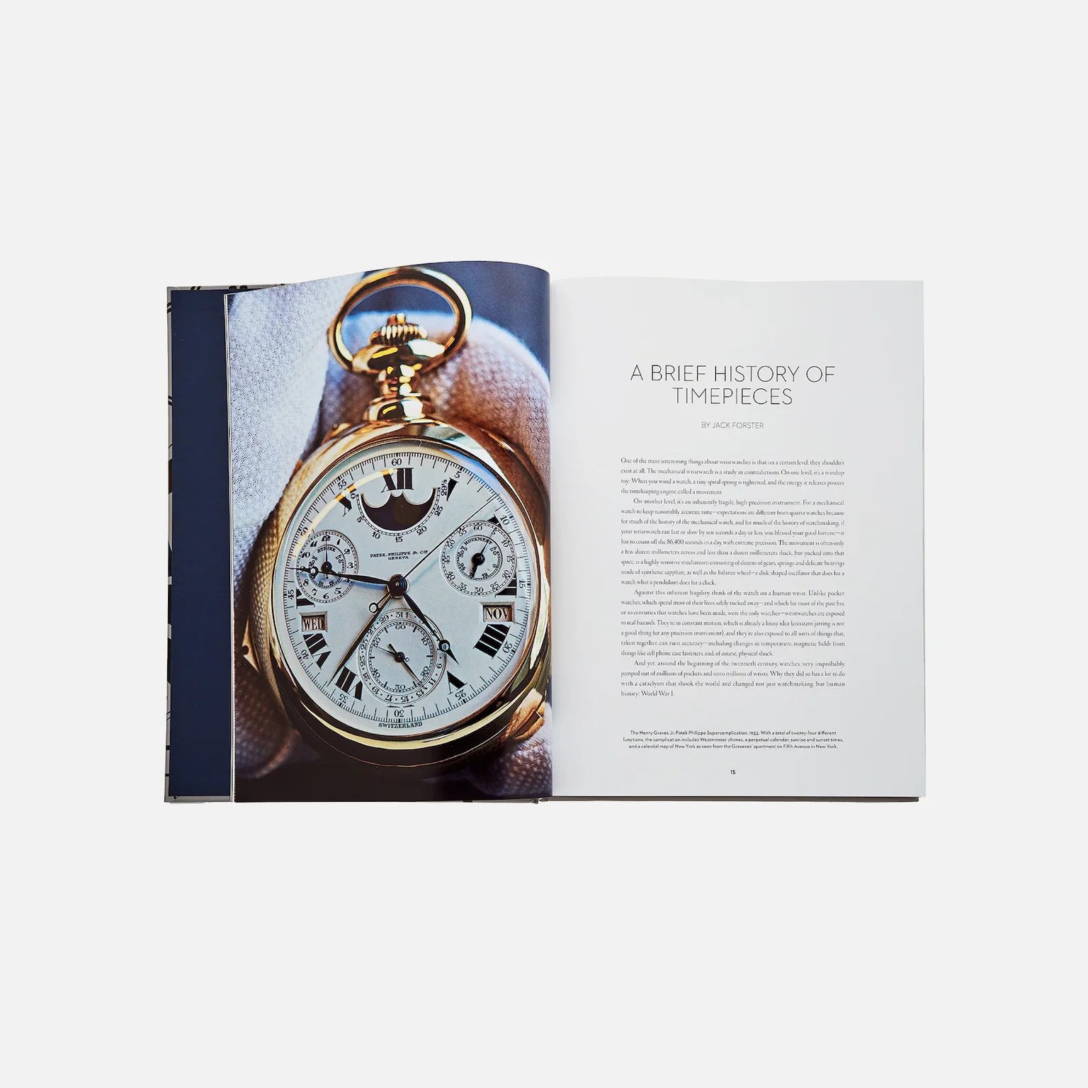 An open book, Watches: A Guide By HODINKEE from Hodinkee, shows a photo of a gold pocket watch on the left and an article titled A Brief History of Timepieces on the right—perfect for watch enthusiasts.