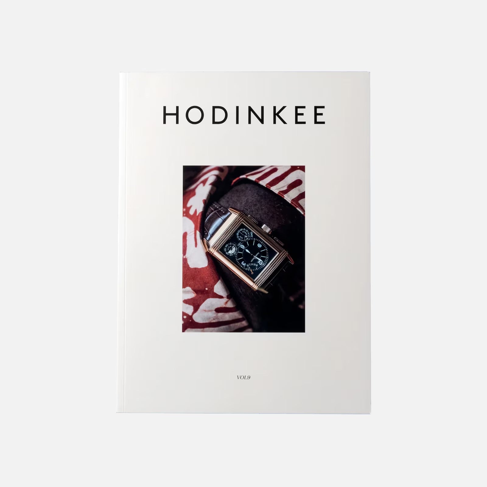 HODINKEE Magazine, Volume 9 by Hodinkee features a wristwatch photo on its white cover, celebrating horology against a red and white patterned background.