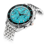 The DOXA Sub 200 C-Graph Aquamarine is a stainless steel chronograph wristwatch with a turquoise dial, three subdials, and a black bezel, displayed at an angle on its silver metal bracelet.