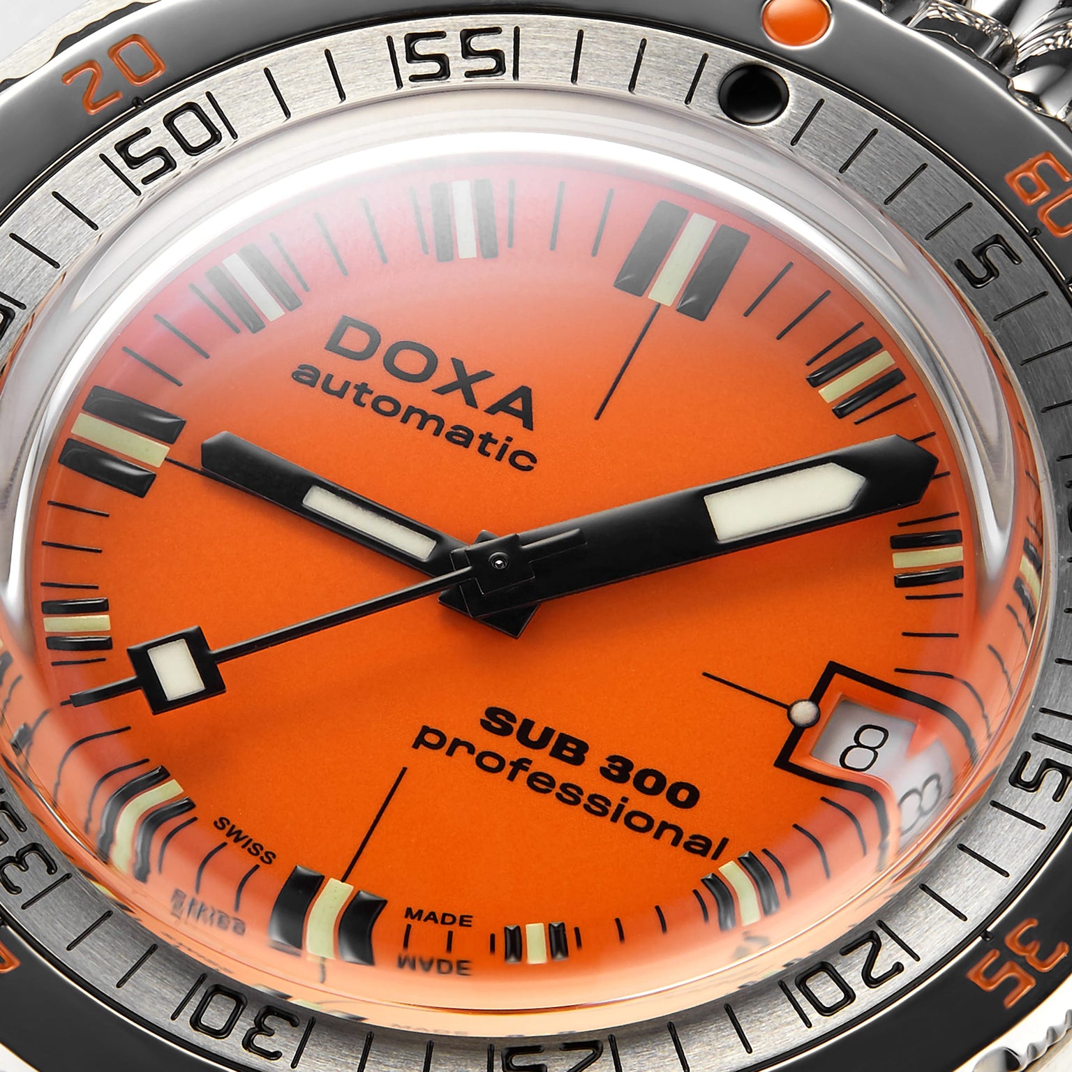 Close-up of the DOXA Sub 300 Professional, showcasing its vibrant orange dial, bold black and white hands, date window at 3 o’clock, and a stainless steel unidirectional bezel.