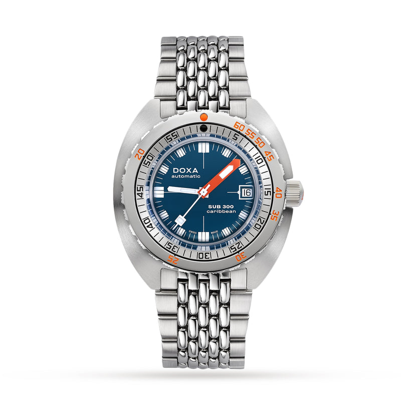 The DOXA Sub 300 Caribbean is a stainless steel diver’s watch with a blue dial, orange accents, date display, metal bracelet, and a unidirectional bezel for safe diving and timeless style.