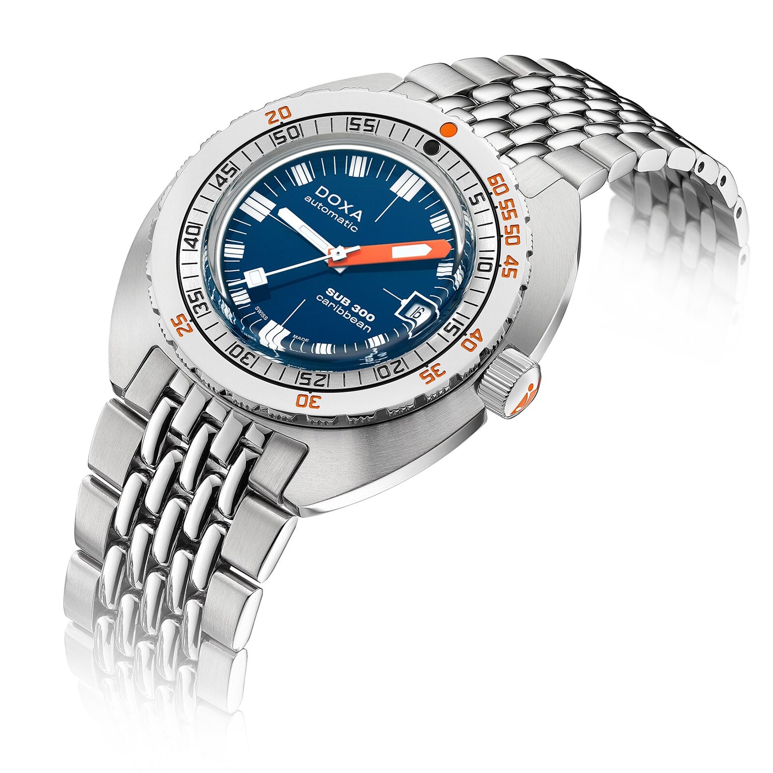 The DOXA Sub 300 Caribbean is a stainless steel automatic divers watch featuring a blue dial, unidirectional bezel, date window, and orange accents on the bezel and hands, presented on a metal bracelet.