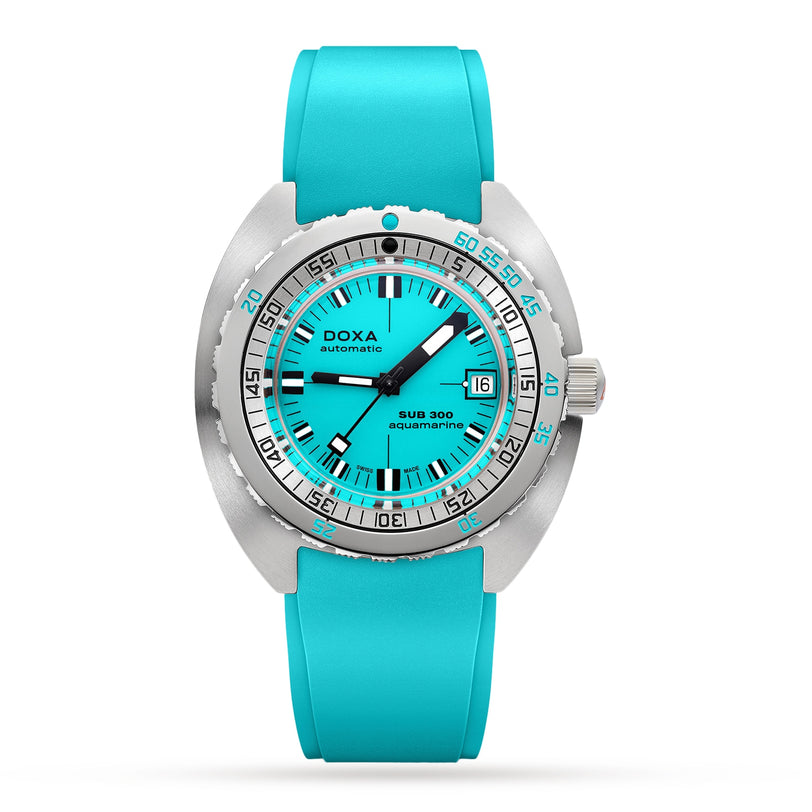 The DOXA Sub 300 Aquamarine is a dive watch featuring a turquoise round dial, date at 3 o’clock, turquoise rubber strap, and a robust 316L stainless steel case.