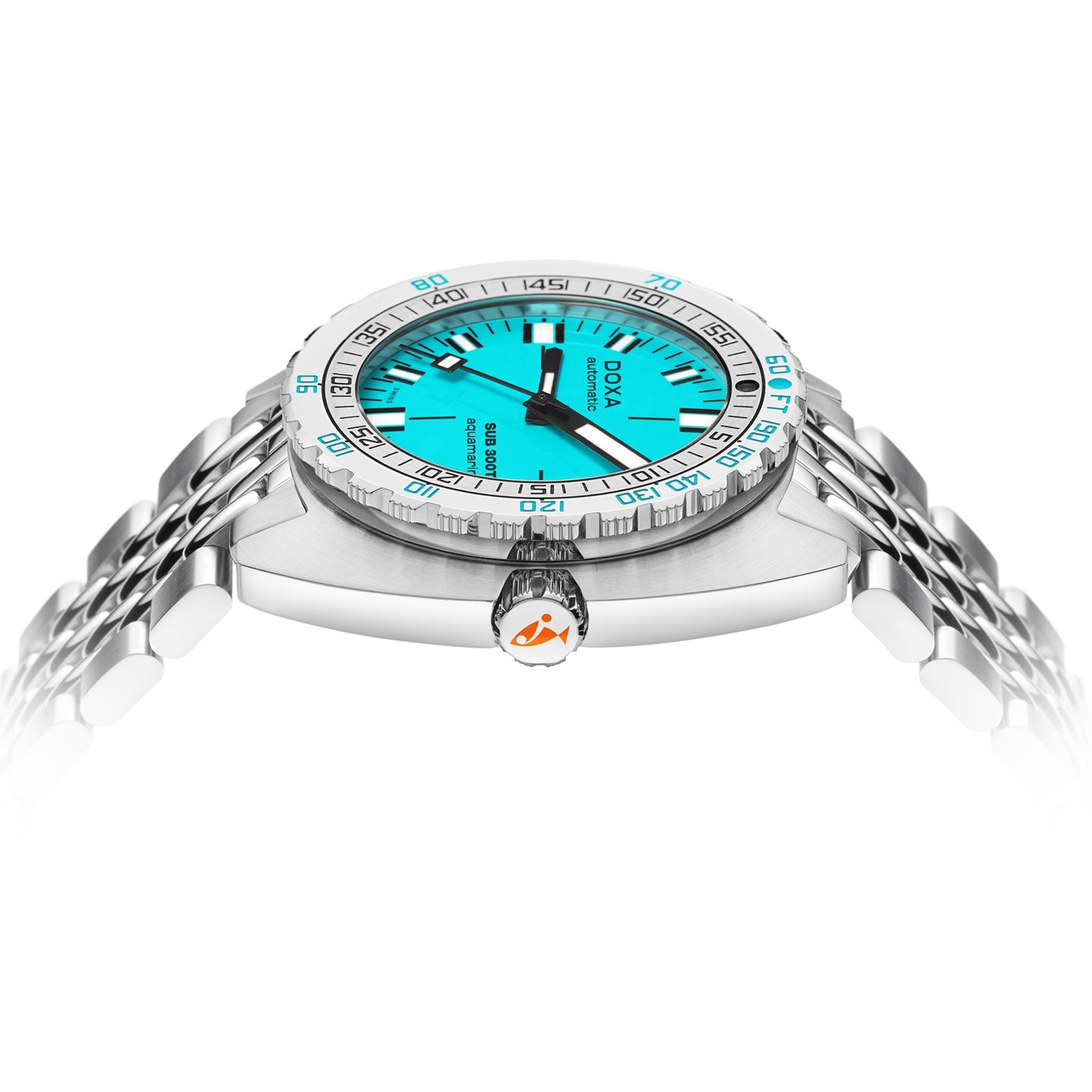 The DOXA Sub 300T Aquamarine is a silver divers watch featuring a vibrant aquamarine dial, black hour markers, and a stainless steel bracelet, highlighted from a low angle with its crown, case side, and helium release valve.